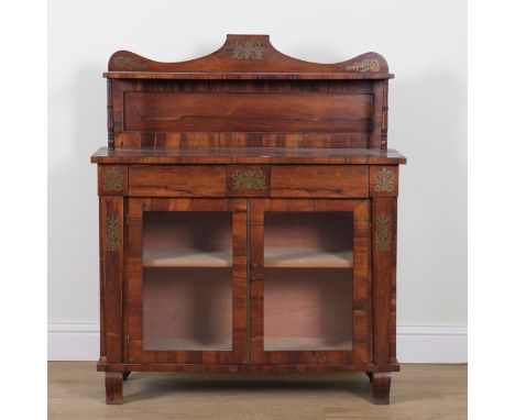 A REGENCY BRASS INLAID ROSEWOOD SHELF BACK CHIFFONIERWith two frieze drawers over glazed cupboards, 106cm wide; 36cm deep; 12
