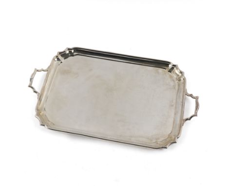 A SILVER SHAPED RECTANGULAR TWIN HANDLED TRAYHaving a Chippendale style raised rim, length including handles 42.5cm, width 25