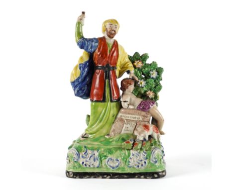 A STAFFORDSHIRE PEARLWARE GROUP OF `ABRAHAM OFFERING UP ISAAC'Circa 1820-30 Abraham standing to the left, his son lying on th