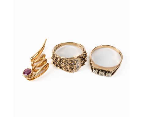 A 9CT GOLD AND DIAMOND KEEPER RING, A 9CT GOLD AND DIAMOND THREE STONE RING AND A GOLD AND RUBY PENDANT (3)The keeper ring si