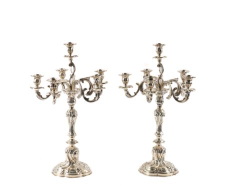 A PAIR OF GERMAN SILVER SIX LIGHT TABLE CANDELABRA (2)Each of rococo inspired scroll and foliate design, detailed 800, height