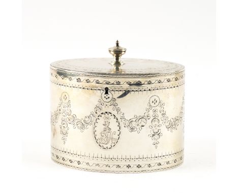 A GEORGE III SILVER OVAL HINGE LIDDED TEA CADDYThe body engraved with floral and foliate swags, crest and monogram engraved a