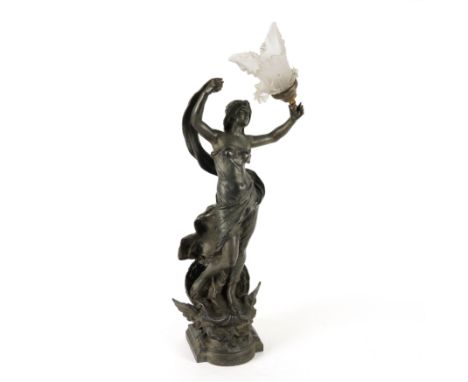 AN ART NOUVEAU PATINATED SPELTER FIGURAL TABLE LAMPEarly 20th Century 
Modelled as a personification of air, holding a froste
