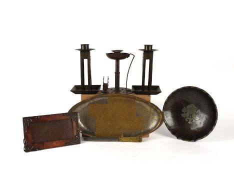 A GROUP OF ARTS AND CRAFTS AND ART DECO TRAYS AND CANDELSTICKS (7)Comprising: an Arts & Crafts by Hugh Wallis planished coppe