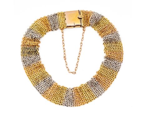 A TWO COLOUR GOLD AND PLATINUM BRACELETIn a woven mesh link design, on a snap clasp, fitted with a safety chain, weight 16 gr