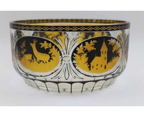 A late 19th century Bohemian overlaid and cut glass fruit bowl, with deer in landscape and architectural decoration, 21.5cm i