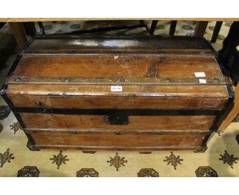 A wooden stave bound slightly domed topped trunk