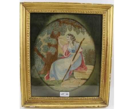 A 19th century silk work picture, depicts a Shepherdess writing on a tree trunk, 29cm x 25cm, oval mounted within a glazed gi