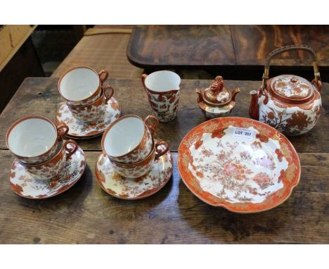 A Japanese floral decorated porcelain tea service for six designed for the European market, broken handle on one cup, three c