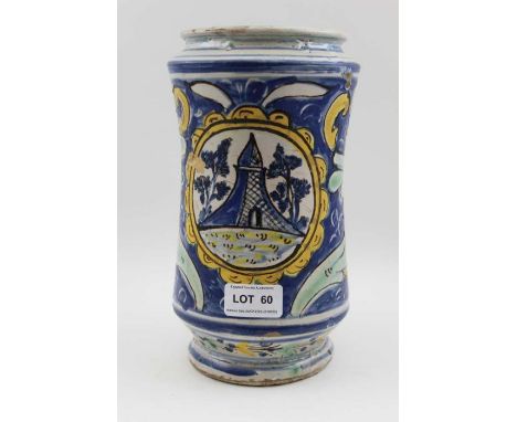 A majolica wet drug jar, hand painted floral, and architectural panel, 23cm high / There are a few cracks to the rim, one goe