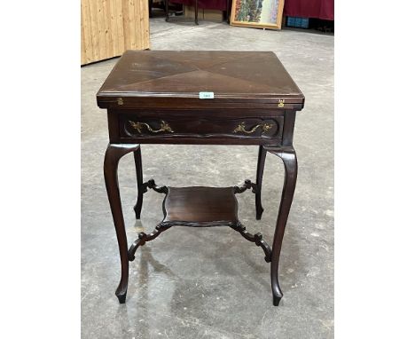 An Edward VII mahogany envelope card table. 22" wide.