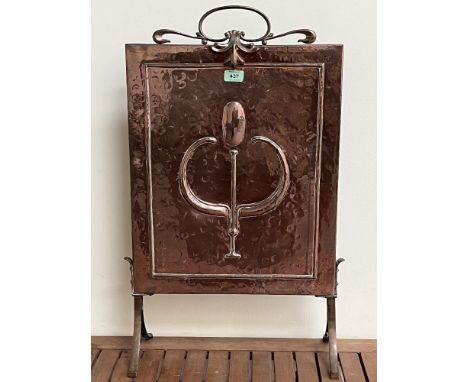 An early 20th Century Art-Nouveau planished copper and brass firescreen, embossed with a stylised tulip. 17"w x 29"h.