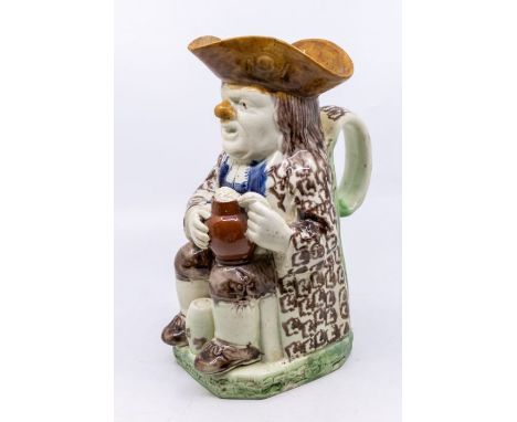 A good Staffordshire Ralph Wood Toby Jug, c.1790, with painted decoration and details of a tankard of beer and a barrel. Size