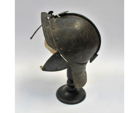 A composite English Civil War 'Dutch Lobster Pot' helmet, The skull piece of two part iron construction, with central raised 