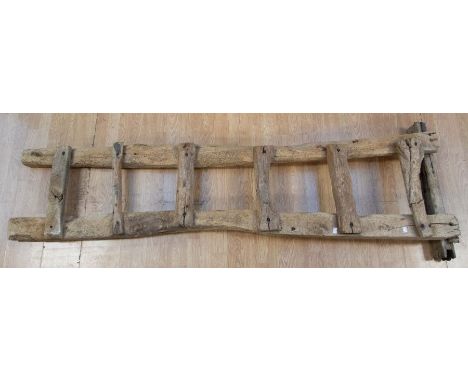 A Provincial elm / limewood ladder, 214cm high treated woodwork throughout 
