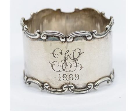 An Edwardian silver napkin ring, Birmingham 1906 by Henry Williamson Ltd, engraved and initialled,Approx. 0.68 ozt and approx