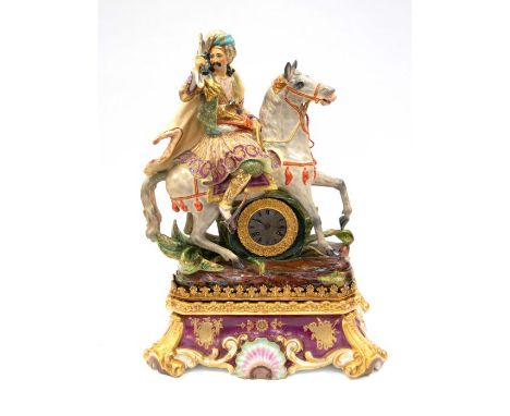 A good French porcelain mantle clock in the style of Petite with 8 day French two train movement, striking on the hours and h
