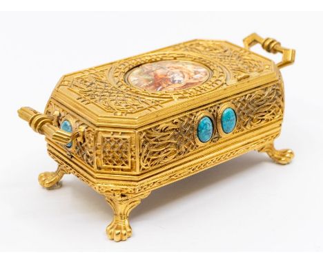 A Singing Bird musical box, automata in a gilt case. Clockwork mechanism inside a gilt case with pop-up bird playing a tune. 