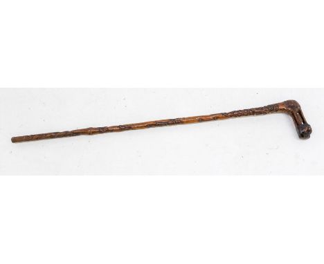 An English carved walking stick, reticulated handle, above tapering stick carved with oak leaves, acorns and JAMES HILL to ba