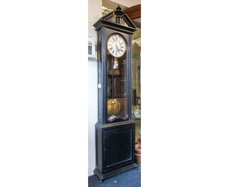 A good floor standing Vienna clock with eight day single train weight driven movement. With 10" two piece porcelain dial with