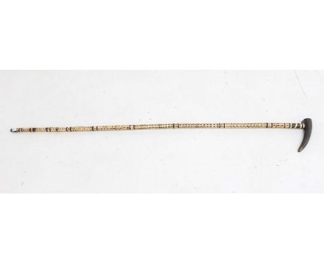 A&nbsp;Shark vertebrae&nbsp;walking stick with ebonised handle and brass ferrule. Approx. 92.5cm long.