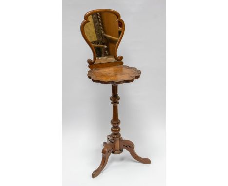 An early Victorian walnut and mahogany shaving table / vanity stand, with walnut veneer pie crust vanity shelf, scroll mirror