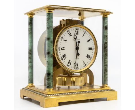 A Jaeger-LeCoultre Atmos clock with 4" white dial, contained in a brass case with four green marble-style pillars, one to eac