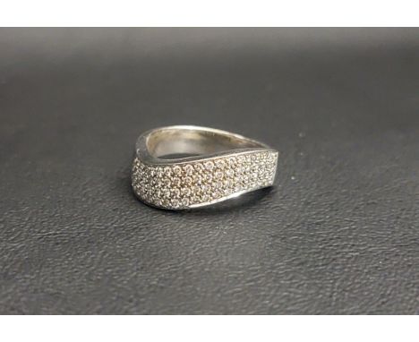 EIGHTEEN CARAT WHITE GOLD DIAMOND RINGthe stylised band in a wave motif, half of which is set with four rows of diamonds, app