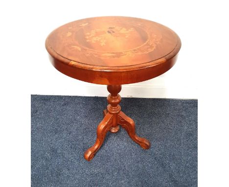 TEAK WINE TABLEwith a circular inlaid floral top on a turned column and tripod base, 59cm high 