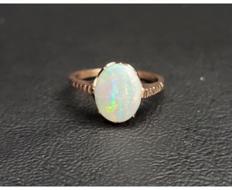 OPAL SINGLE STONE RINGthe oval cabochon opal measuring approximately 11.2mm x 8.8mm, on unmarked gold shank, ring size K and 