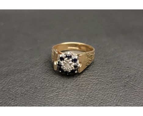DIAMOND AND SAPPHIRE CLUSTER RINGthe central illusion set diamond in eight sapphire surround, on nine carat gold shank with t