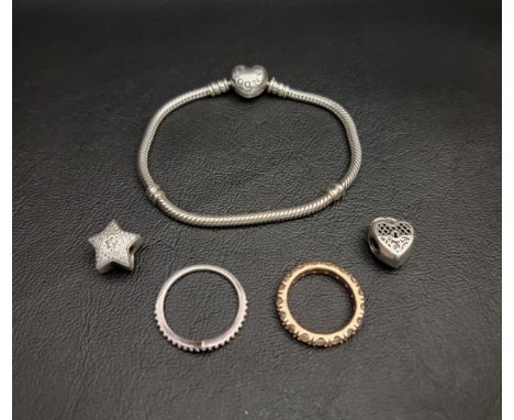 SELECTION OF PANDORA JEWELLERYcomprising a Moments Heart Clasp Snake Chain bracelet, a Pave Wishing Star charm, a Love You He