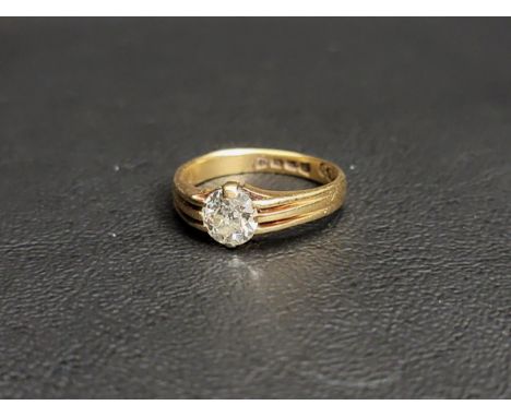 DIAMOND SOLITAIRE RINGthe round brilliant cut diamond approximately 0.8cts, flanked by decorative ribbed shoulders, on eighte