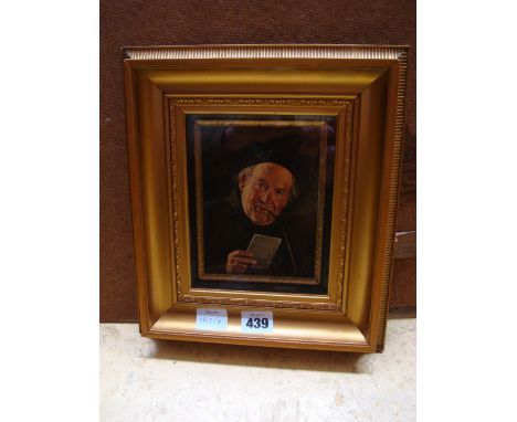 An early 20th Century gilt framed print of a German monk smoking a pipe, after Kronberger. 