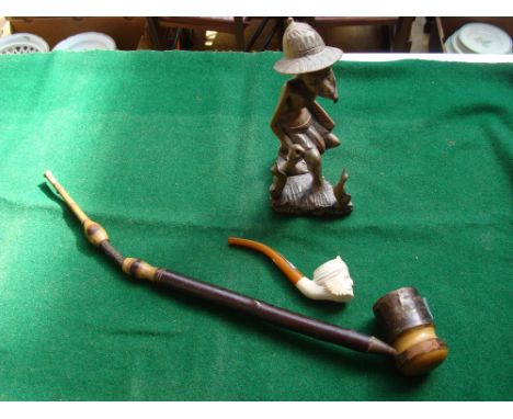 A sub meerschaum pipe. a poss German pipe and an African carving (3). 
