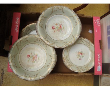 An early Victorian porcelain dessert service, each piece painted to centre in enamel colours with a spray of flowers within a