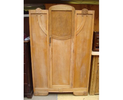 An Art Deco single door wardrobe. 