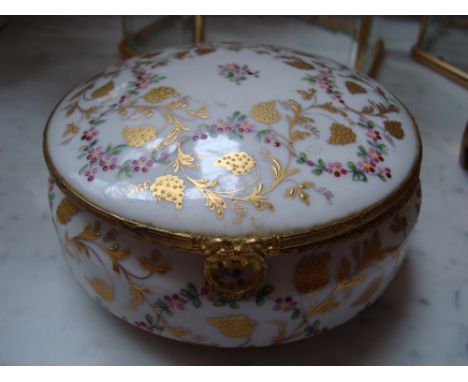 A 20th Century French lidded pot, enamel and gilt decorated.