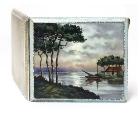 An Art Deco silver and enamelled cigarette case,the hinged cover centred with an enamelled panel of a moonlit coast with a co