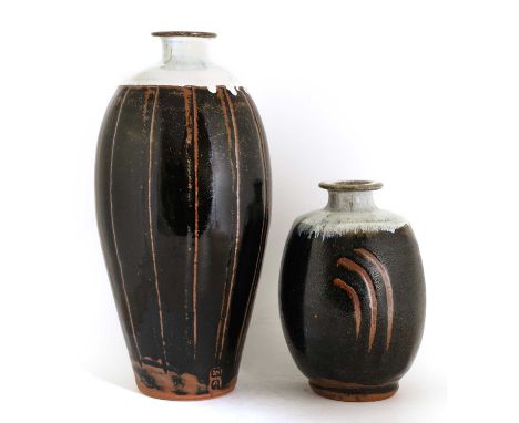 *Jim Malone (b.1946),a slender ovoid stoneware vase, with a pale glazed shoulder over an incised body in a black tenmoku glaz