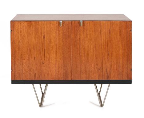 A Stag 'S' Range teak cabinet,designed by John and Sylvia Reid, enclosing a shelf and three slides, 91cm wide46cm deep69.5cm 