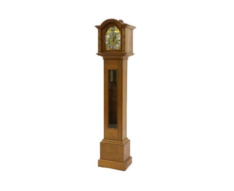 A Robert 'Mouseman' Thompson oak grandmother clock,with a carved hood, with the signature mouse, enclosing the arched brass d