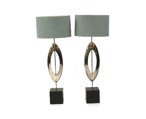 A pair of contemporary 'Manhattan' table lamps,by Porta Romana, each with a silvered support and slate plinth, with a light b