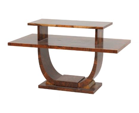 An Art Deco walnut two-tier table,of rectangular shape, the smaller upper tier quarter-veneered and raised on a 'U' shaped st