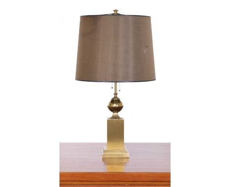 A French gilt table lamp, fitted with two lights, with a shaft and ball column raised on a square plinth, with shade, 68cm hi