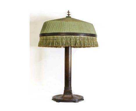 A patinated bronze Art Nouveau table lamp,early 20th century, the stem impressed with secessionist-style designs, with an ova