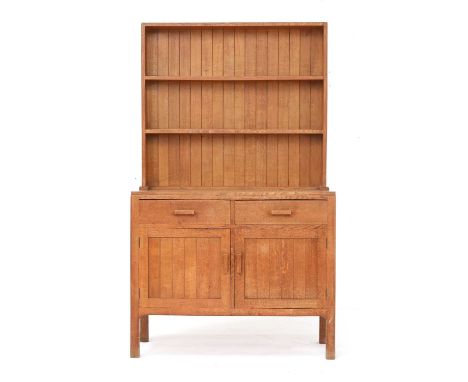 A Cotswold School oak dresser,the boarded rack with two shelves, over two drawers and a cupboard below, 106cm wide46cm deep17