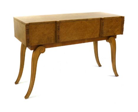 An Art Deco burr maple console table,by Hille, with three frieze drawers, with carved anthemion details, raised on scrolled s