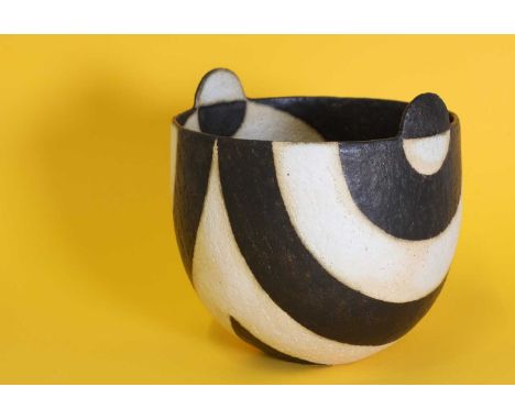 *John Ward (b.1938),a black and white ceramic bowl with lugs, signed with artist's monogram 'JW', with a scalloped base, 13cm