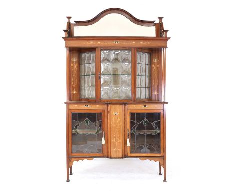 A mahogany inlaid side cabinet,in the manner of Shapland &amp; Petter, surmounted with a mirror back, over a leaded glass cab